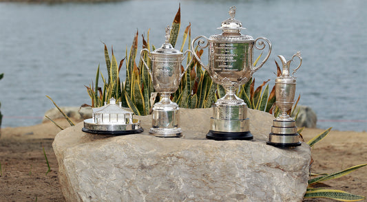 Trophies sitting on a rock